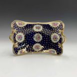 A Spode porcelain twin-handled rectangular basket, circa 1820, the blue ground decorated with gilded