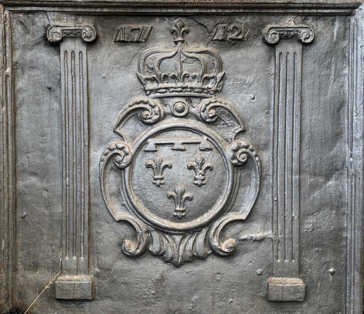 A 17th century style cast iron fireback, probably circa 1900, decorated with a crowned armorial