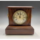 An American walnut cased 8 day mantel clock, with lion mask side handles, the movement striking on a
