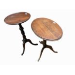 A George III mahogany tripod table, height 72.5cm, diameter 38cm and an oak tripod table.