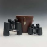 A pair of Carl Zeiss Jenoptem 10 X 50W binoculars, cased, together with a similar pair of 8 X 30W