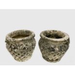 Pair of reconstituted stone urn-shaped planters with moulded decoration. Height 28cm.