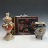 A Japanese Satsuma vase, the cover with eagle mount, decorated with chrysanthemums, on a socle base,