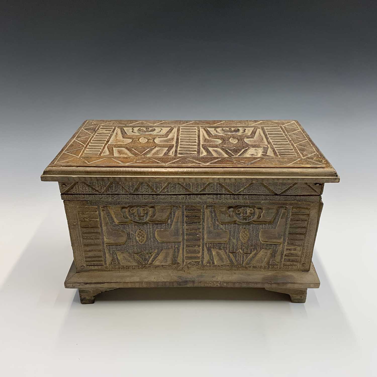 An African carved wood box with figural and geometric decoration. Height 22cm, width 35cm, depth - Image 4 of 7