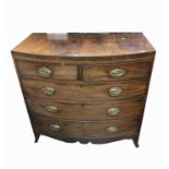 A mahogany bow front chest of drawers, early 19th century, with two short and three long drawers, on
