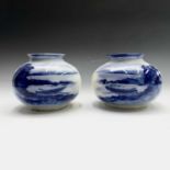 A pair of late 19th/early 20th century Edge Malkin & Co. Burslem blue and white vases of squat form,