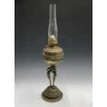 A Victorian brass oil lamp in the manner of F & C Osler, the reservoir with embossed floral