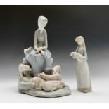 A Lladro figure of a seated maiden surrounded by five piglets, printed impressed and inscribed marks