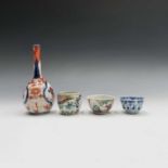 A 19th century Cantonese famille rose tea bowl, a Cantonese jar, an 18th/19th century Chinese blue