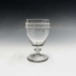 A 19th century glass rummer, the etched border with repeated star motif, on a knopped stem, height