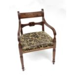 A William IV mahogany carver chair with bar back, reeded arms over upholstered seat, on turned front