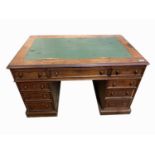 A Victorian mahogany pedestal desk, with an arrangement of nine drawers, height 73.5cm, width 125cm,