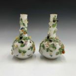 A pair of Dresden porcelain vases, probably Carl Thieme, of shaft and globe form, moulded in high