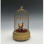 A brass singing bird musical box, probably by Eschle of Germany. Height 26cm.Condition report: Lacks