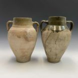 A near pair of terracotta olive jars with green glaze to rim. Both approximately 33cm tall.