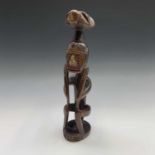 An ethnic carved wood figure. Height 40cm.