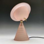 An Art Deco style frosted pink glass and gilt metal 'Saturn' table lamp. Height 28cm.Condition