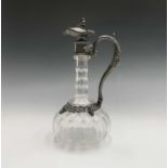 A Victorian glass claret jug with ornate EPBM mounts. Height 30cm.