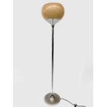 Harvey Guzzini, A 1970s chrome floor lamp, with butterscotch acrylic globe shade, on a chrome stand,