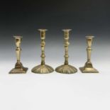 A pair of George III brass candlesticks with petal bases, height 20cm, and a pair of Victorian brass