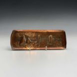 A Newlyn Industrial Class copper pen tray, repousse decorated with sailing boats. 7.25cm x 20cm.