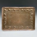 A Newlyn Industrial Class documentary copper tray, the rim repousse decorated with a band of