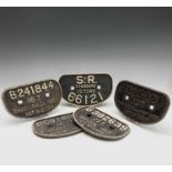 A group of five cast iron railway wagon plates, to include SR standard 12 tons, P & W Maclellan,