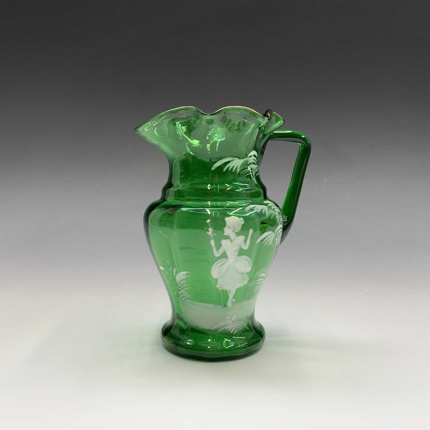 A Mary Gregory green glass jug, late 19th century, enamelled with a figure, height 17cm, together - Image 2 of 20