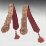 A pair of Victorian gilt metal and embroidered velvet bell pulls. Length 140cm overall.