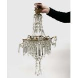A gilt metal and cut glass chandelier, with spear drops, approx. height 55cm and one other