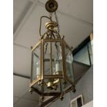 A pair of brass hall lanterns of hexagonal form. Height 42.5cm.Condition report: Width 19cm,