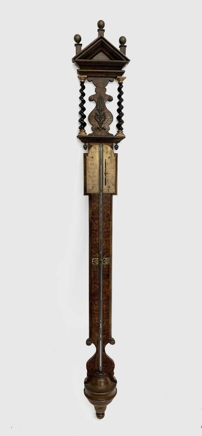 A William III style walnut mercury stick barometer, circa 1900, the brass scale bears signature H.