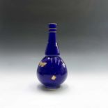 A Mintons aesthetic movement baluster vase, the cobalt blue ground decorated in gilt with