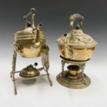 An Art Nouveau brass tea kettle on stand, with burner, height 32cm and one other (2).