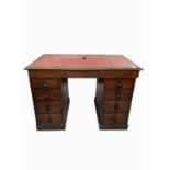 A Victorian oak pedestal desk, the red leather inset top above a single long frieze drawer, four