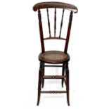 A Victorian stained beech childs correction chair, height 100cm.