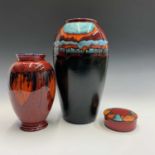 A Poole pottery limited edition Millennium vase, height 34cm, together with a similar smaller vase