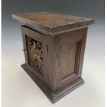 Arts & Crafts walnut collector's cabinet, a single door with acanthus carved panel enclosing three