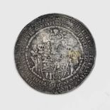 An early 18th century lead alloy medallion, possibly German or Dutch, cast with a coat of arms and a