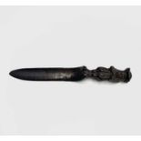 A late 19th/early 20th century Black Forest carved oak letter opener with figural handle, signed
