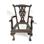 A George III style mahogany carver chair, with leaf and scroll carved ornate back and similar