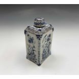 A Dutch delft blue and white tea caddy and cover, circa 1800, of tall rectangular section, painted