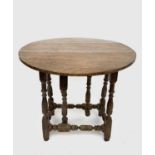 An Arts and Crafts style small oak gateleg occasional table, on turned square section legs, height