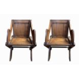 A pair of Glastonbury oak armchairs, late 19th century, height 87.5cm, width 63cm.Condition