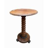 A Victorian mahogany occasional table, the circular moulded top on a bobbin turned stem, height 69.