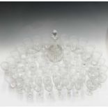 A cut glass decanter, a suite of drinking glassware with etched Greek key pattern decoration