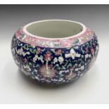 A Chinese bowl/jardiniere, 20th century, floral painted on a blue ground, height 16cm.