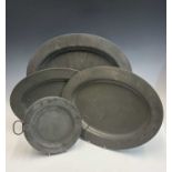 A matched set of three graduated pewter oval meat platters, early 19th century, London touchmarks,