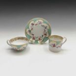 A Derby porcelain trio, circa 1800, the turquoise and gilt border with floral garlands, the saucer