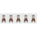 A set of five Arts and Crafts oak dining chairs, including one carver.Condition report: Small amount